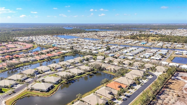 aerial view featuring a residential view and a water view