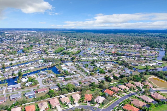 bird's eye view with a residential view and a water view