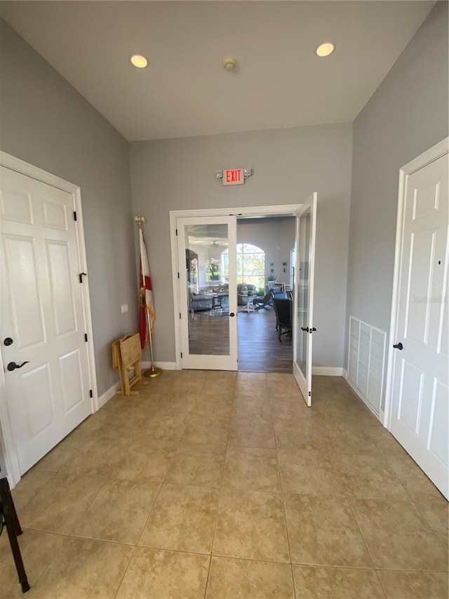 corridor with visible vents, recessed lighting, french doors, light tile patterned floors, and baseboards