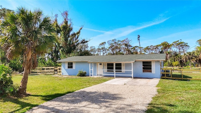 ranch-style home with a front yard