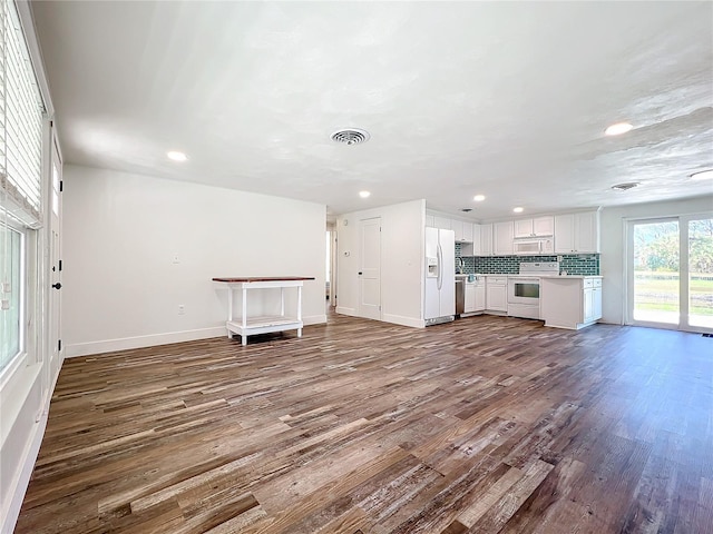 unfurnished living room with hardwood / wood-style floors