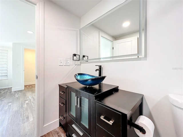 bathroom featuring vanity and hardwood / wood-style floors