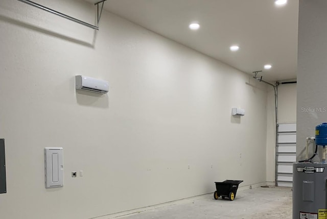 garage with electric water heater and a wall mounted air conditioner