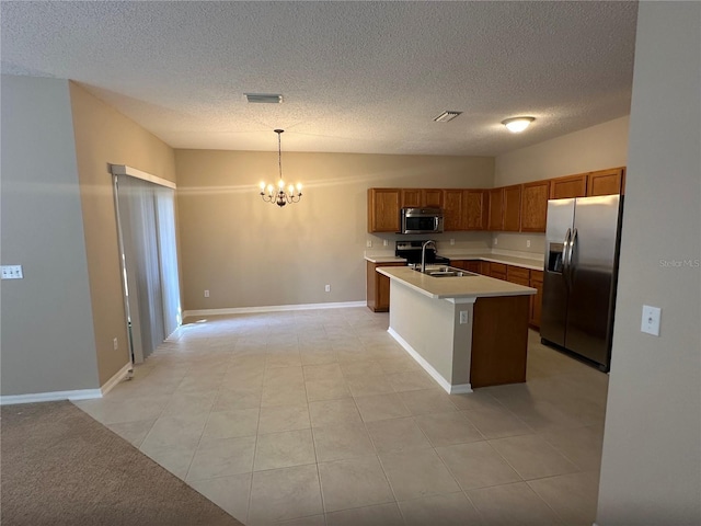431 Honeycomb Way, Saint Johns, FL 32259 - kitchen with appliances with stainless steel finishes, a sink, brown cabinetry, light countertops, and a chandelier