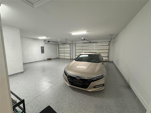 garage with a garage door opener and electric panel