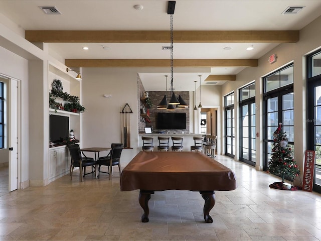 playroom with beam ceiling and billiards