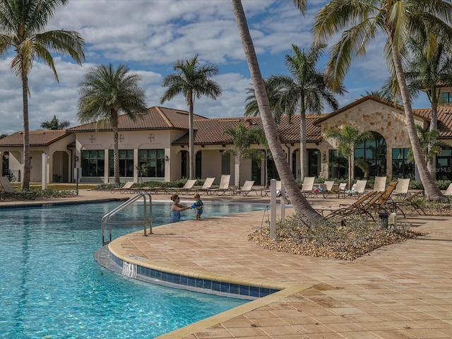 view of swimming pool with a patio