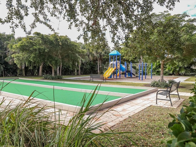 view of swimming pool with a playground