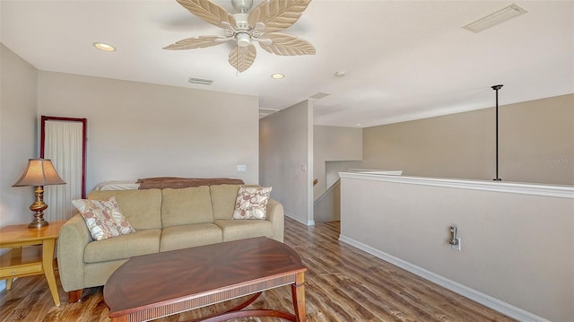 living room with hardwood / wood-style flooring and ceiling fan