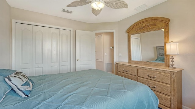 bedroom with ceiling fan and a closet