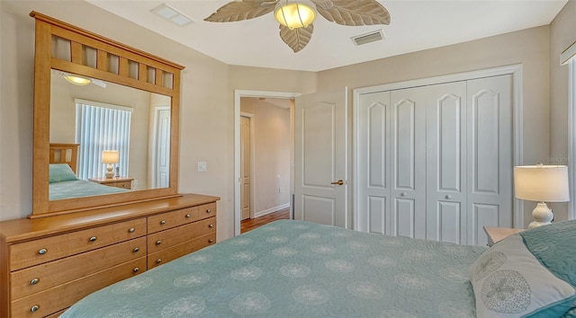 bedroom featuring ceiling fan and a closet