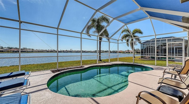 view of swimming pool with a lanai, a lawn, a patio, and a water view