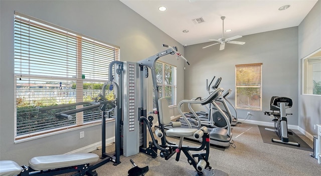 exercise area with ceiling fan and light carpet