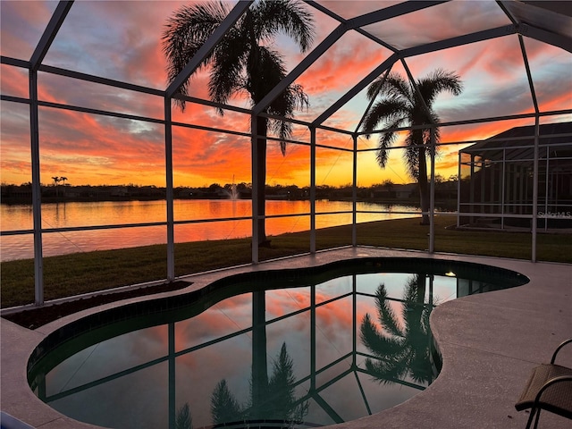 outdoor pool featuring a patio, a yard, a water view, and a lanai