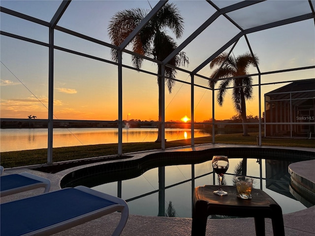 outdoor pool featuring a patio area, a lanai, and a water view