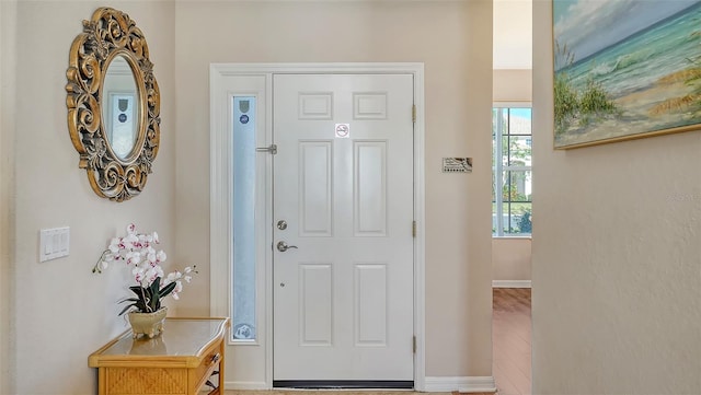 foyer entrance with baseboards