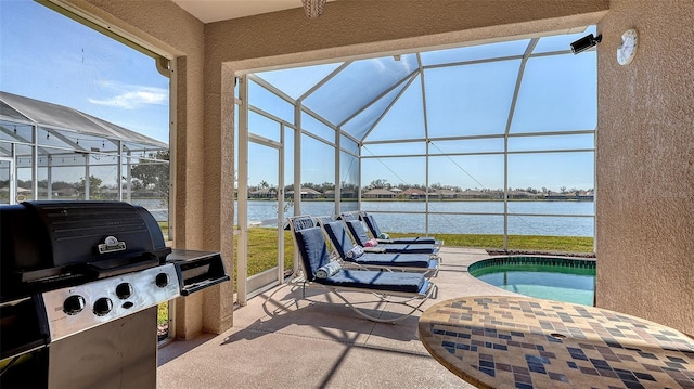 view of patio / terrace featuring a lanai, a water view, a pool, and area for grilling