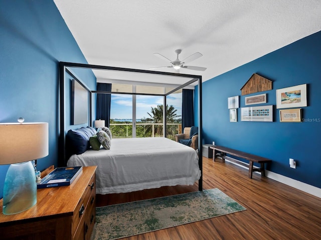 bedroom featuring hardwood / wood-style flooring and ceiling fan