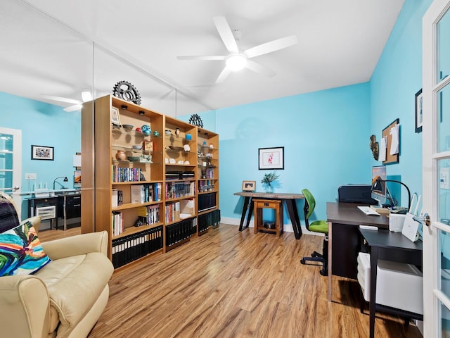 office space featuring light hardwood / wood-style flooring and ceiling fan