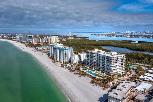 drone / aerial view featuring a water view and a beach view