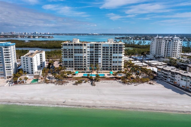 birds eye view of property featuring a water view and a view of the beach