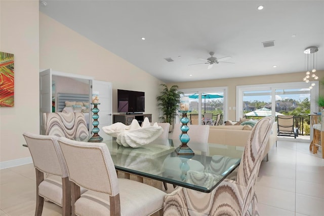 dining area with light tile patterned floors, vaulted ceiling, and ceiling fan