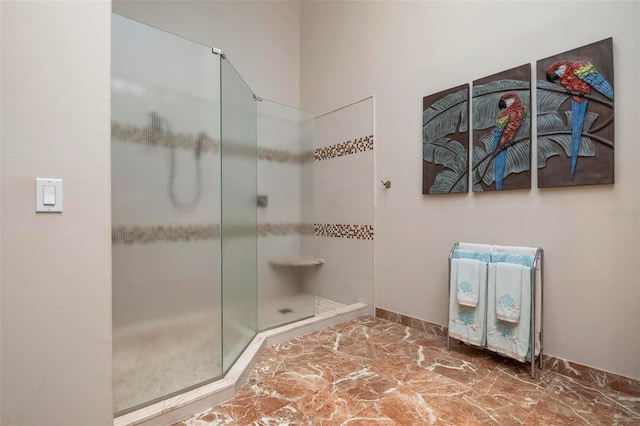 bathroom with tiled shower