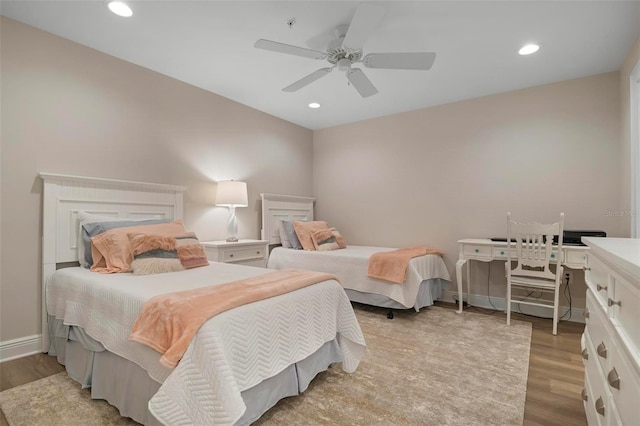 bedroom featuring ceiling fan and light wood-type flooring