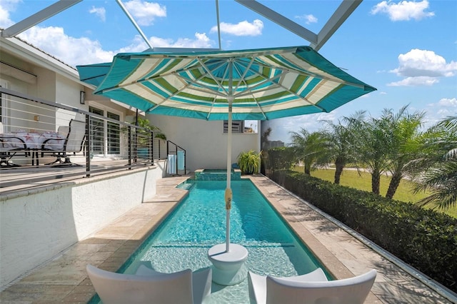 view of swimming pool with glass enclosure