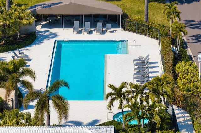 view of swimming pool with a patio