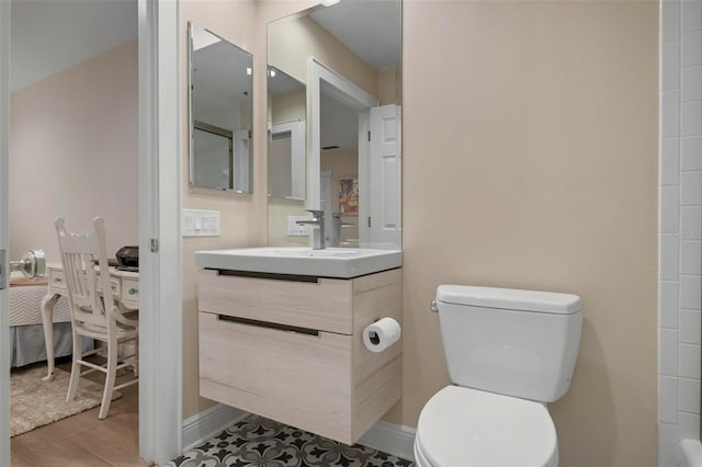 bathroom with vanity and toilet