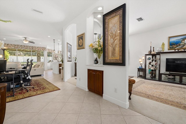 hall featuring light tile patterned flooring