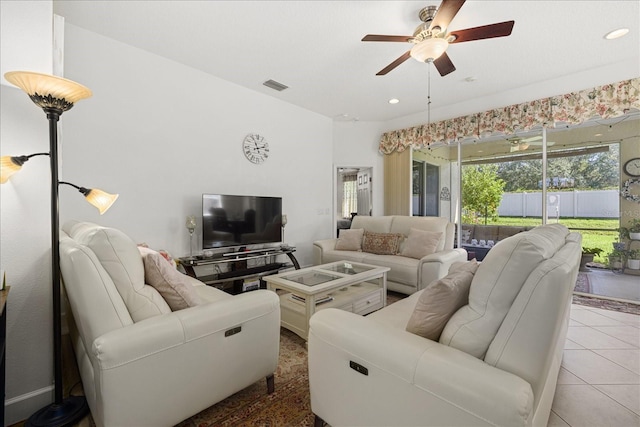 tiled living room featuring ceiling fan