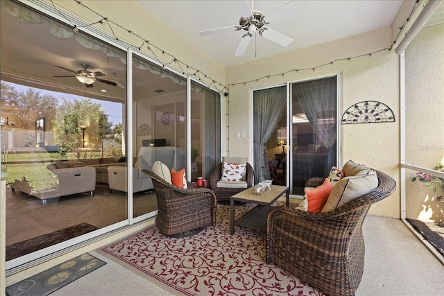 sunroom featuring ceiling fan