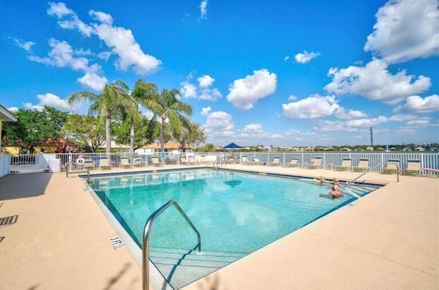 view of swimming pool featuring a patio