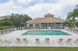 view of swimming pool with a yard and a patio area