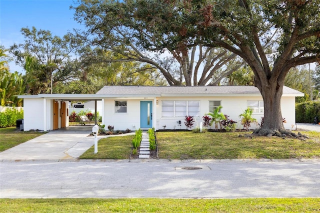 single story home with a carport and a front yard