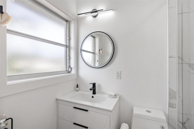 bathroom with vanity and toilet