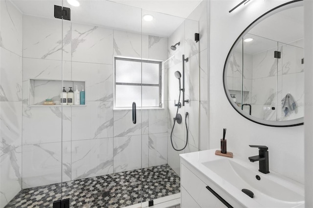 bathroom with vanity and an enclosed shower