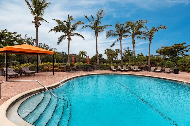 community pool featuring a patio and a gazebo