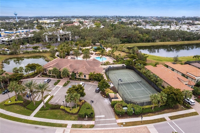 drone / aerial view featuring a residential view and a water view