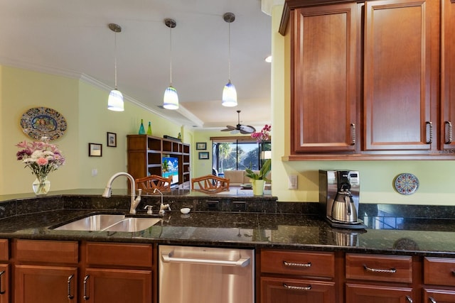 kitchen with hanging light fixtures, dishwasher, dark stone countertops, and a sink