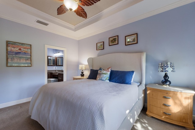 carpeted bedroom with a raised ceiling, visible vents, ornamental molding, a ceiling fan, and baseboards