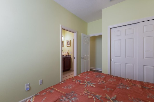 unfurnished bedroom featuring a closet and connected bathroom