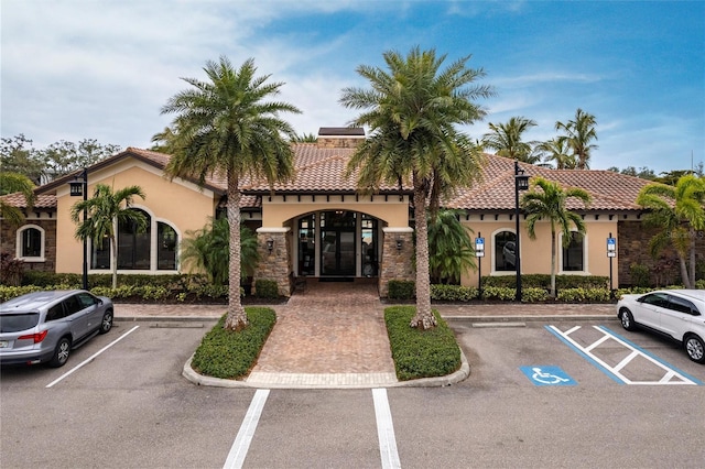 view of property featuring uncovered parking