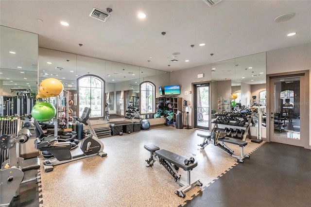 workout area featuring recessed lighting and visible vents