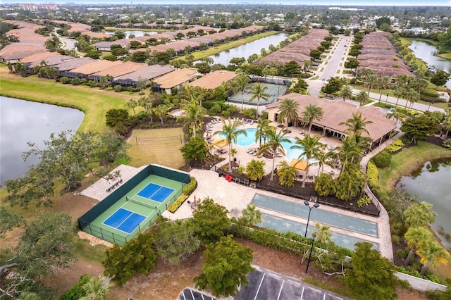 drone / aerial view with a water view and a residential view