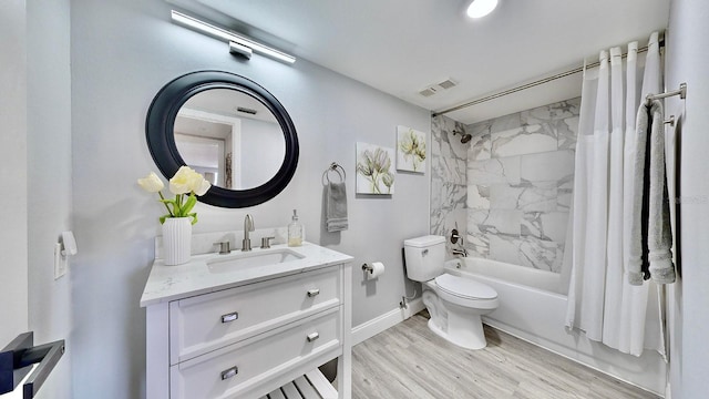 full bathroom with shower / bath combination with curtain, vanity, toilet, and hardwood / wood-style floors