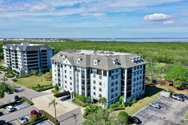 birds eye view of property with a water view