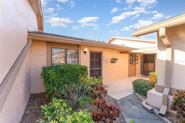 doorway to property featuring a patio